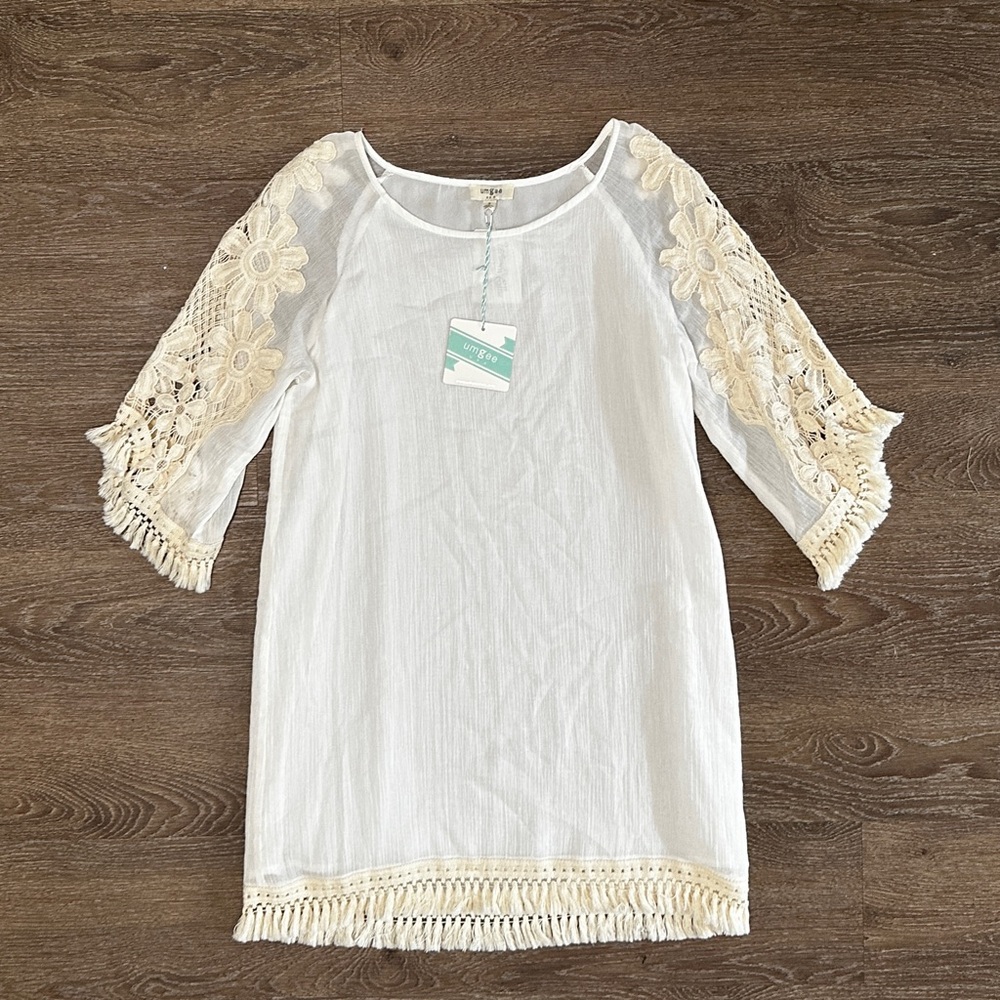 Umgee
Mini dress with floral crochet sleeves and fringe detail size S Small NWT - Picture 13 of 13